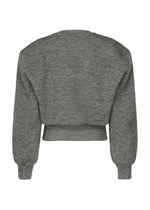 A detail shot of the ISSEY MIYAKE HANDSOME KNIT top.
