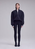 A model wears the ISSEY MIYAKE HANDSOME KNIT handsome-knit-top-off-white-1.