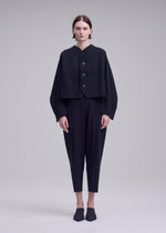 A model wears the ISSEY MIYAKE CAMPAGNE campagne-cardigan-black-9.
