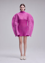 A model wears the ISSEY MIYAKE PANINI PULLED panini-pulled-dress-black.