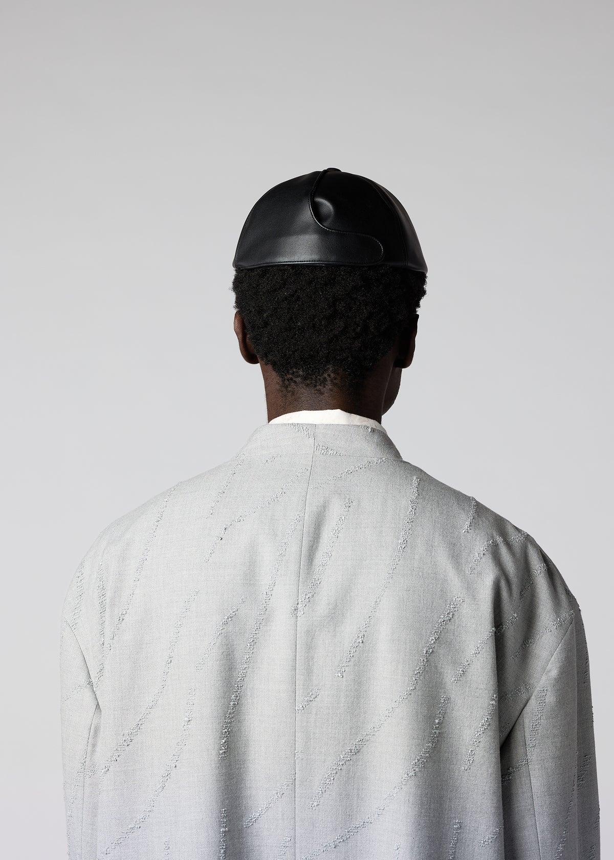 A model wears the IM MEN PIGEON CAP hat.