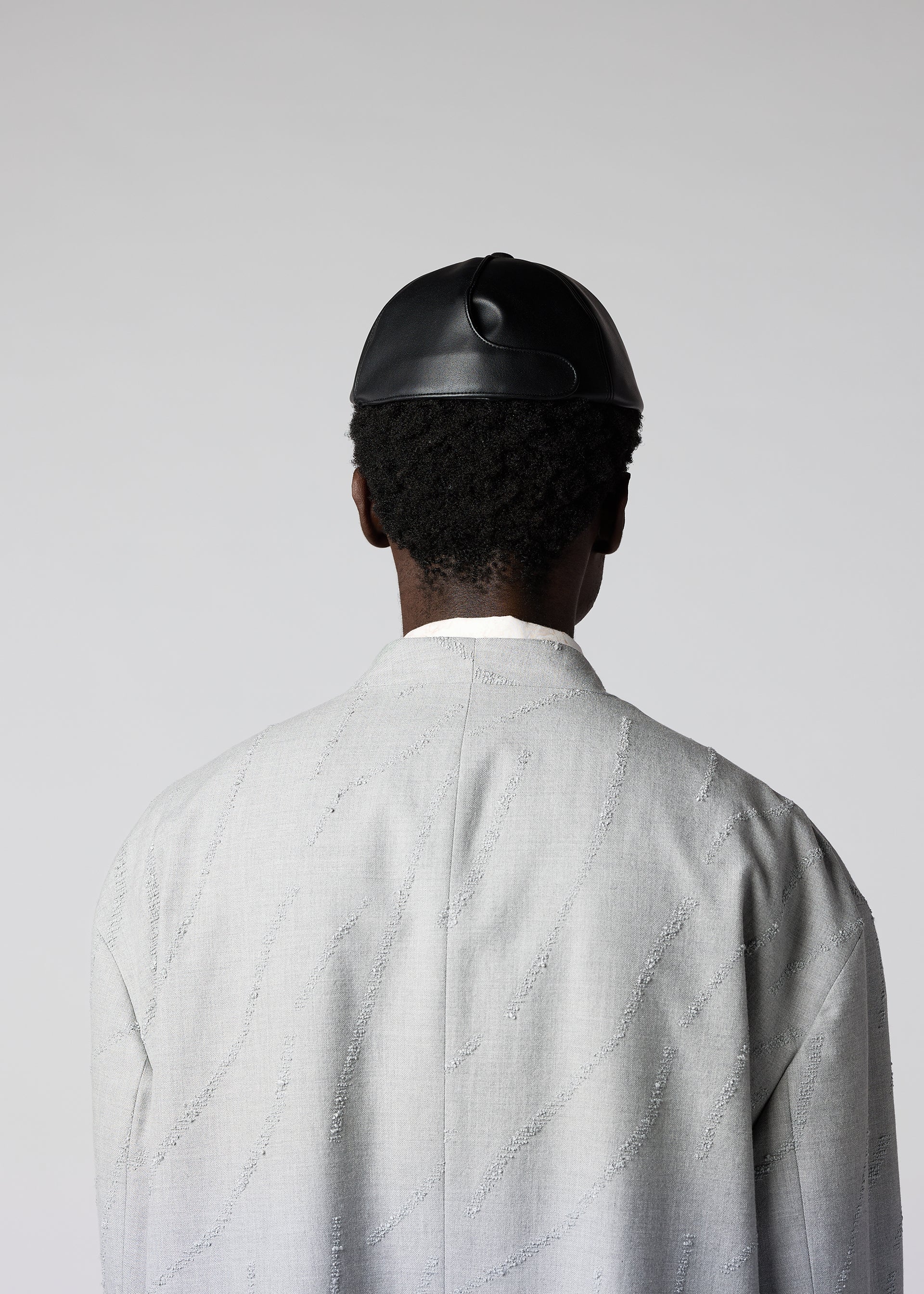 A model wears the IM MEN PIGEON CAP hat.