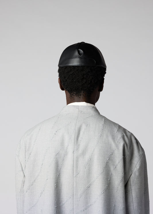 A model wears the IM MEN PIGEON CAP hat.