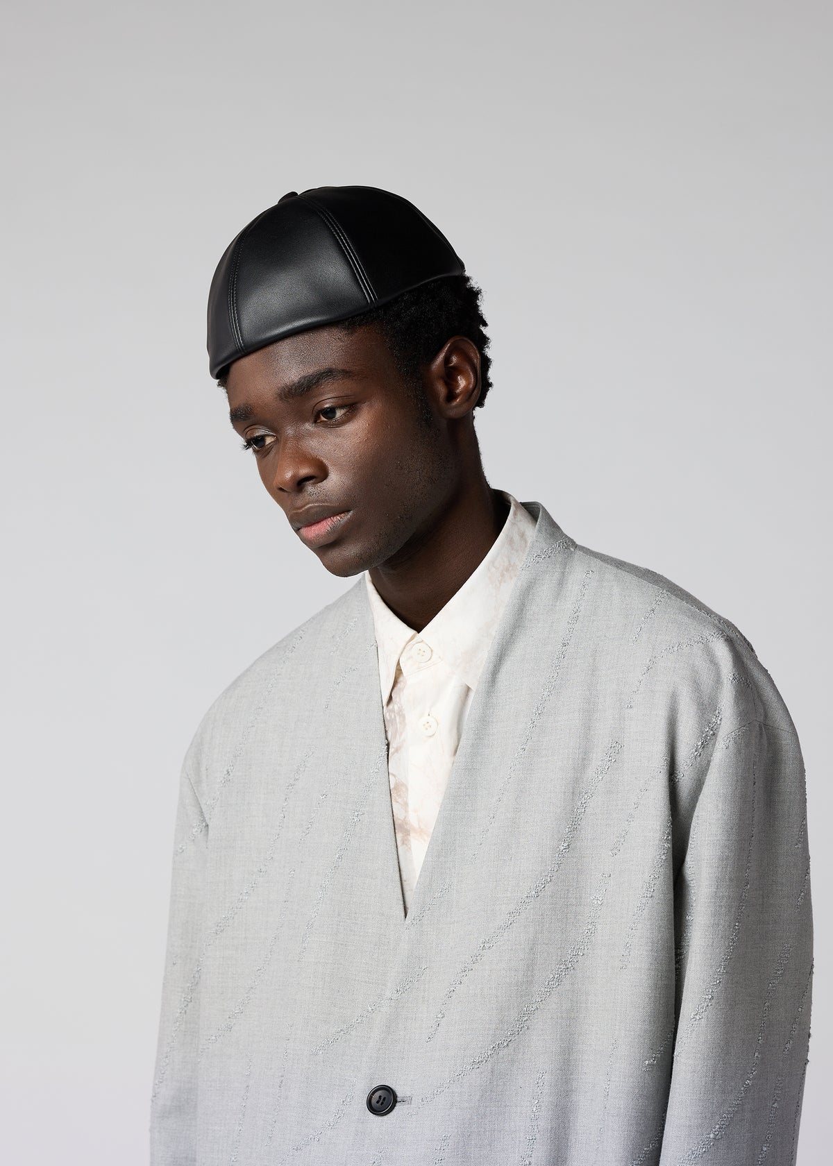 A model wears the IM MEN PIGEON CAP hat.