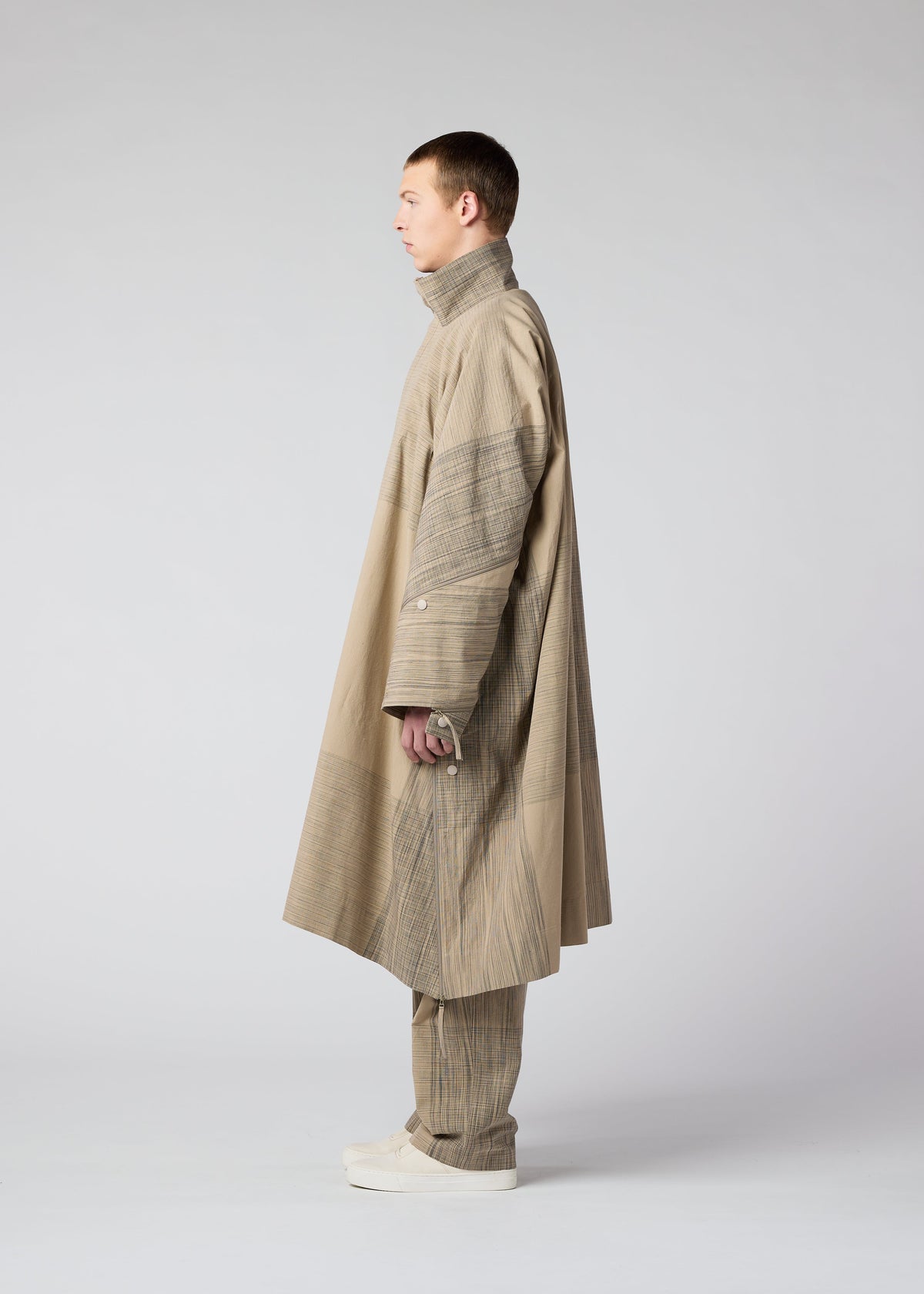 A model wears the IM MEN KASURI coat.