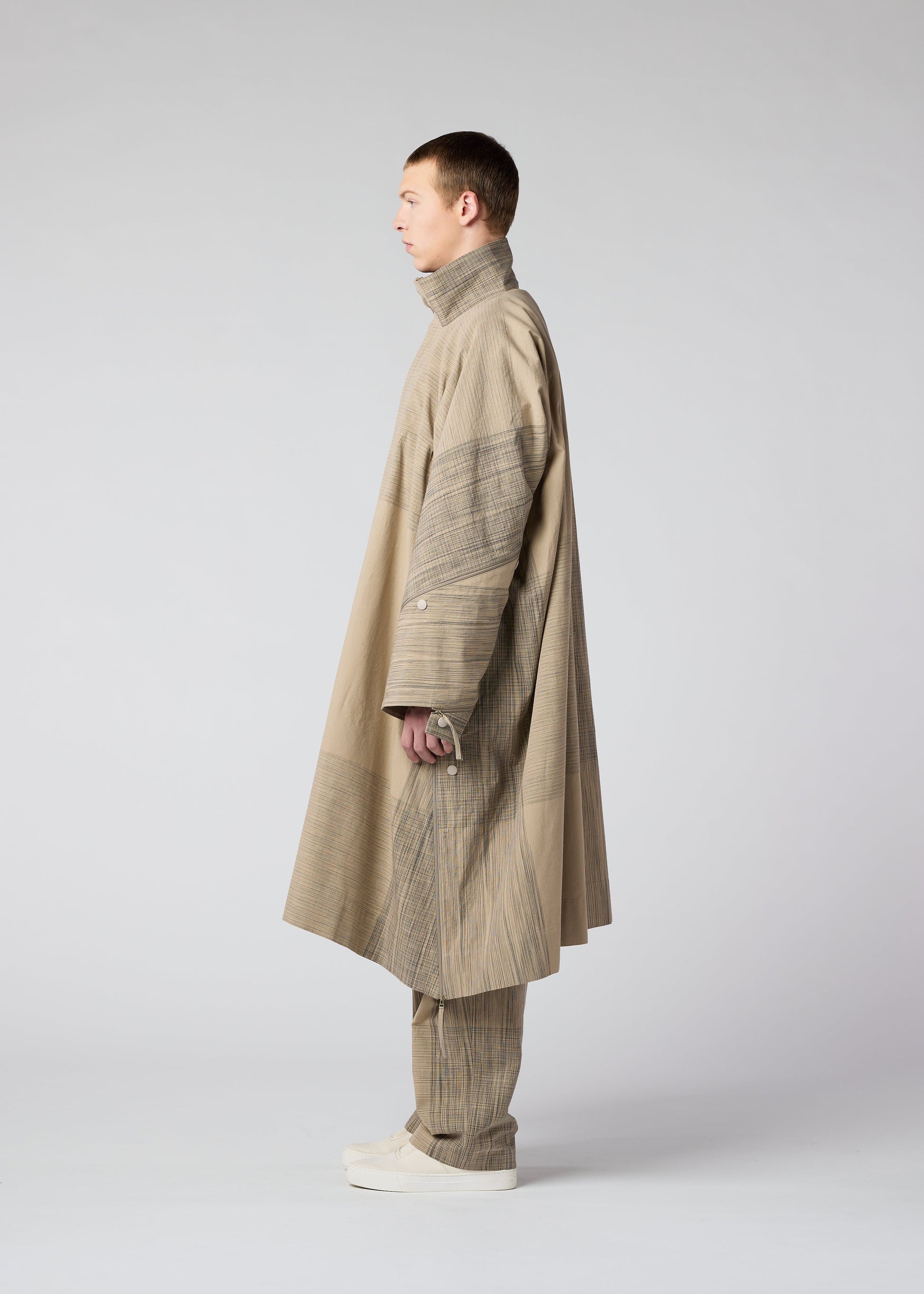 A model wears the IM MEN KASURI coat.
