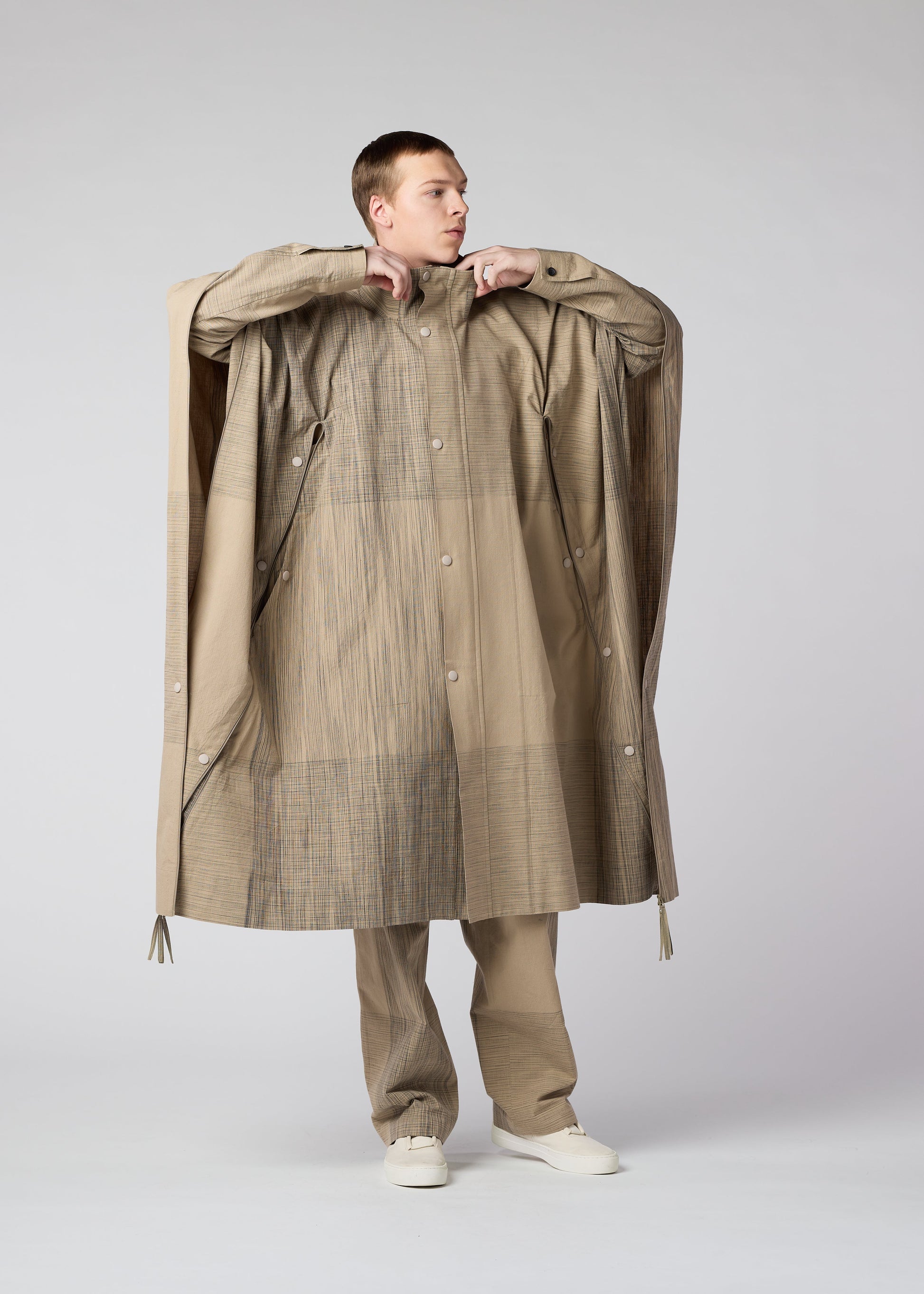 A model wears the IM MEN KASURI coat.