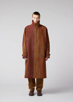 A model wears the IM MEN PAINTING JACQUARD coat.