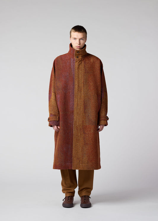 A model wears the IM MEN PAINTING JACQUARD coat.