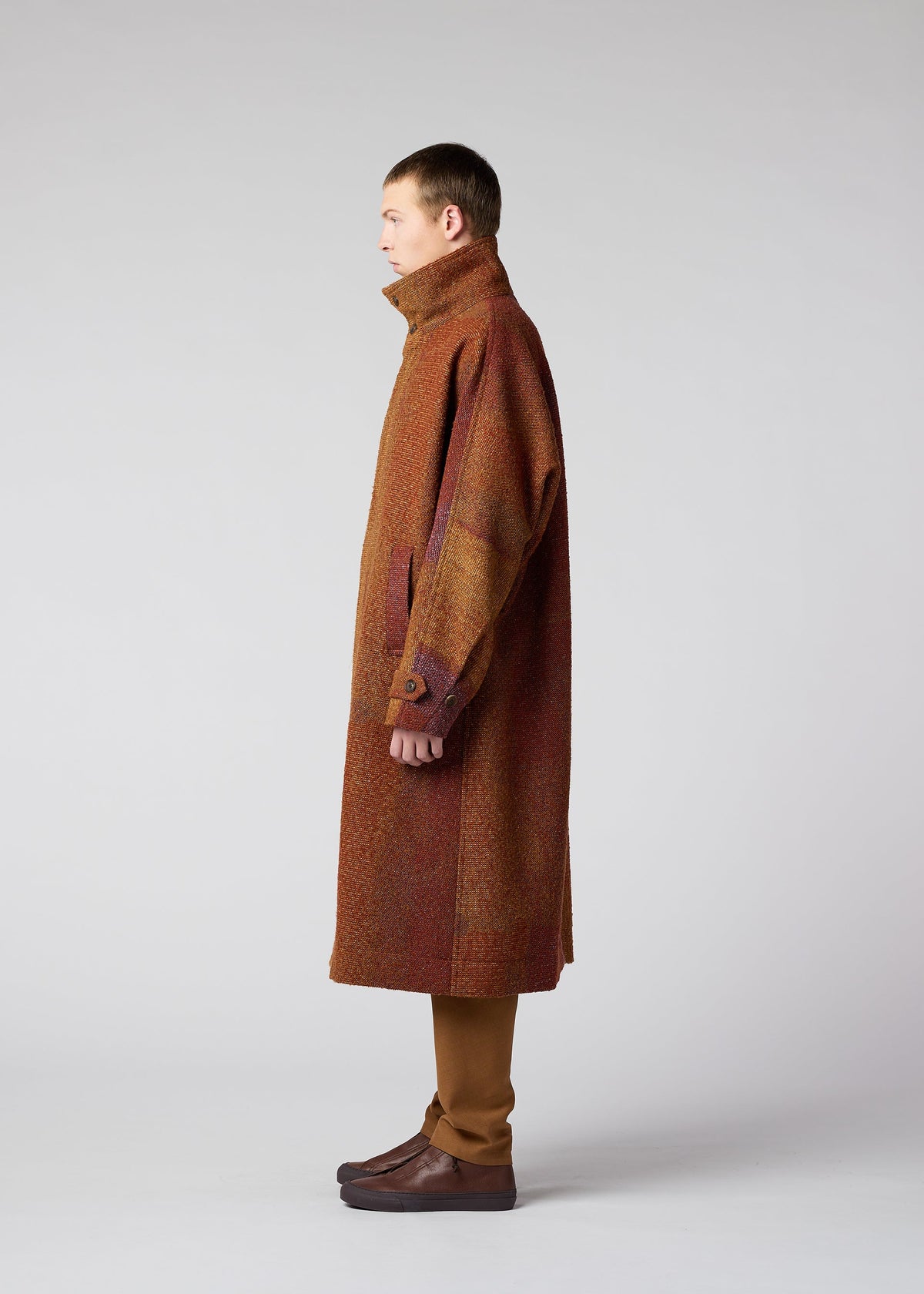 A model wears the IM MEN PAINTING JACQUARD coat.