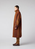 A model wears the IM MEN PAINTING JACQUARD coat.