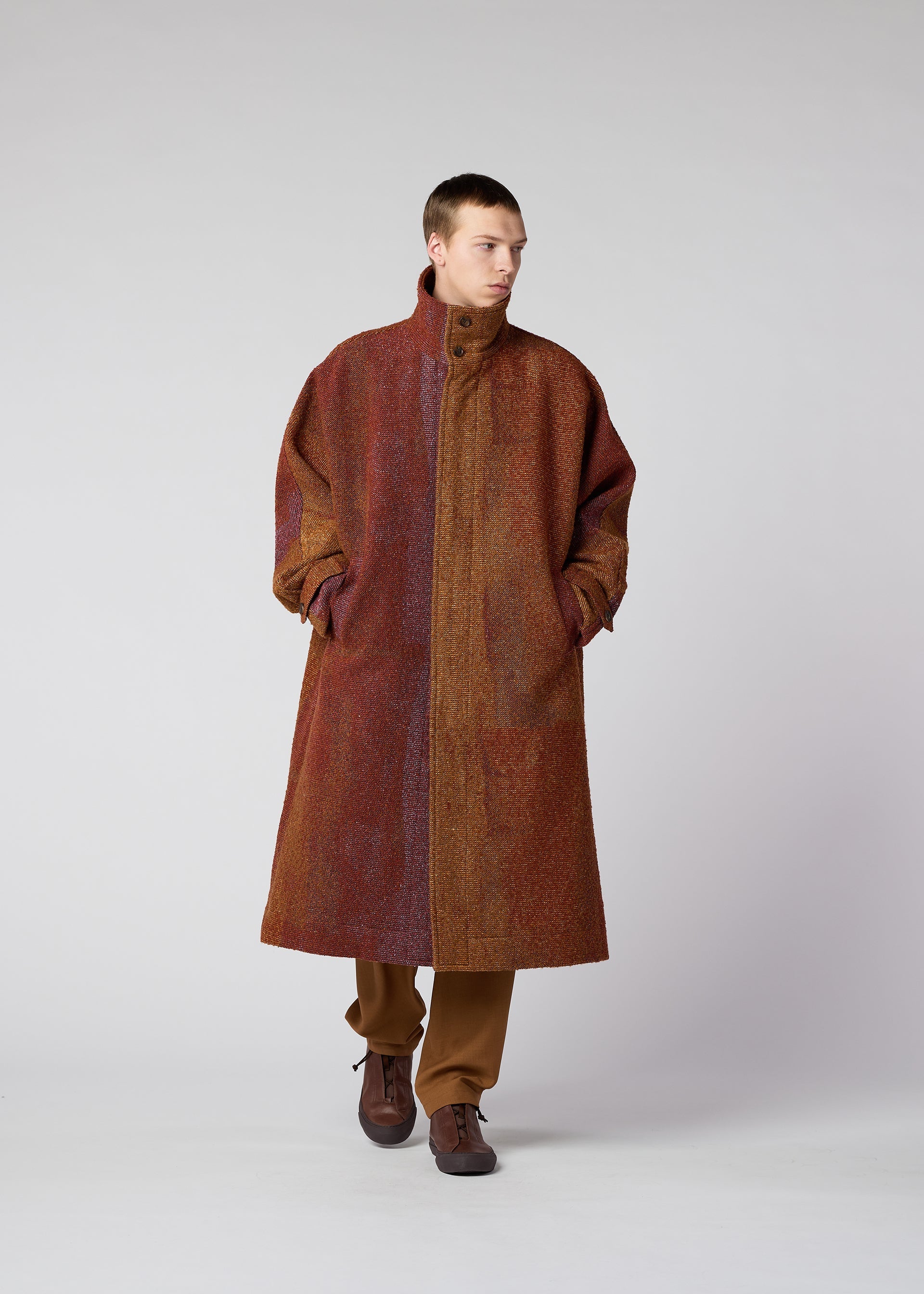 A model wears the IM MEN PAINTING JACQUARD coat.