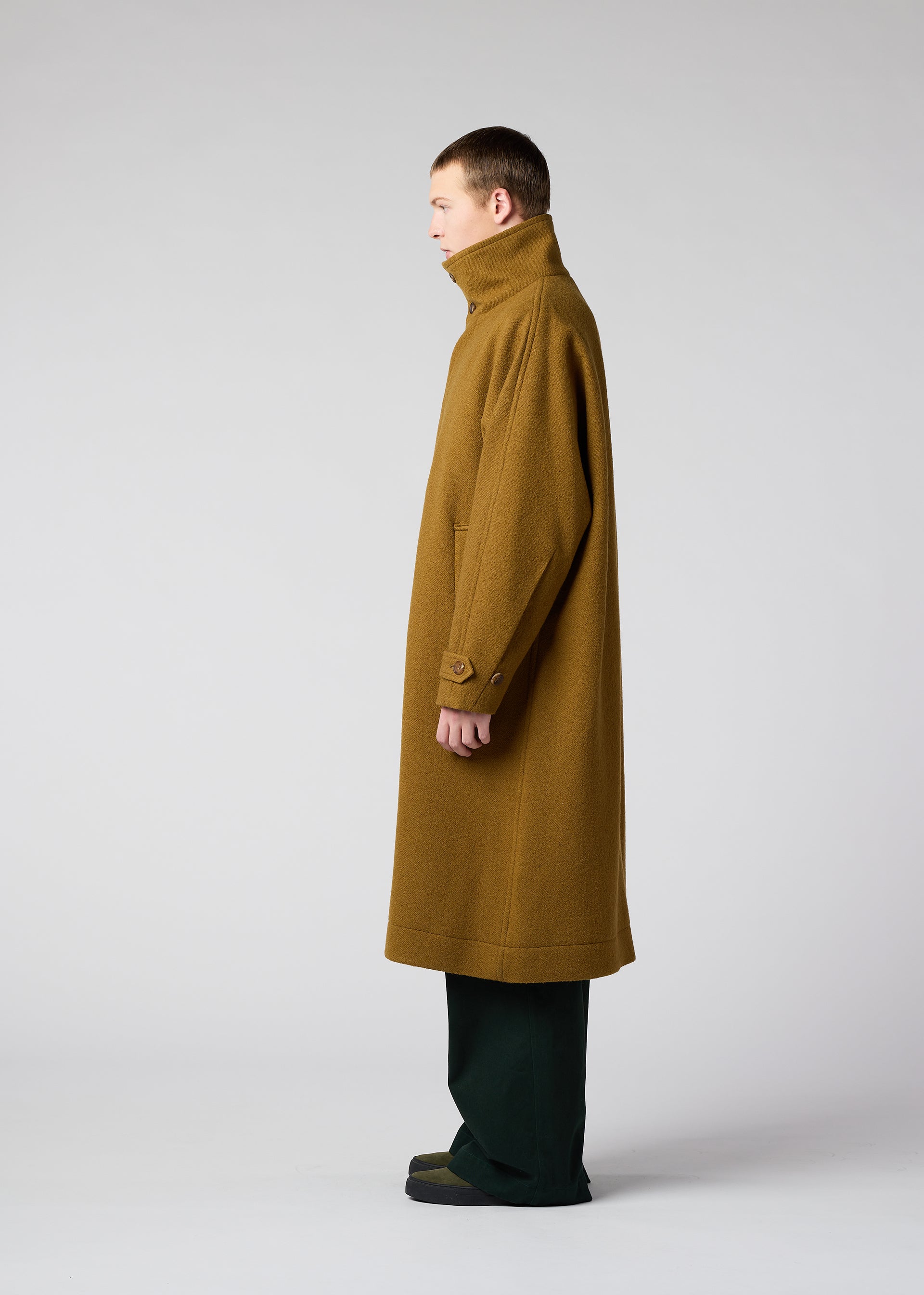 A model wears the IM Men FULLER WOOL coat.