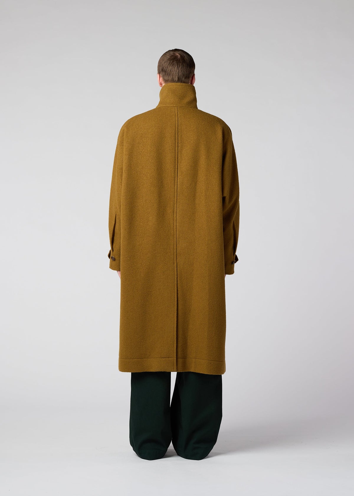 A model wears the IM Men FULLER WOOL coat.