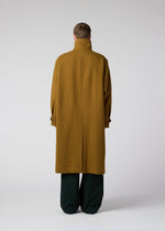 A model wears the IM Men FULLER WOOL coat.