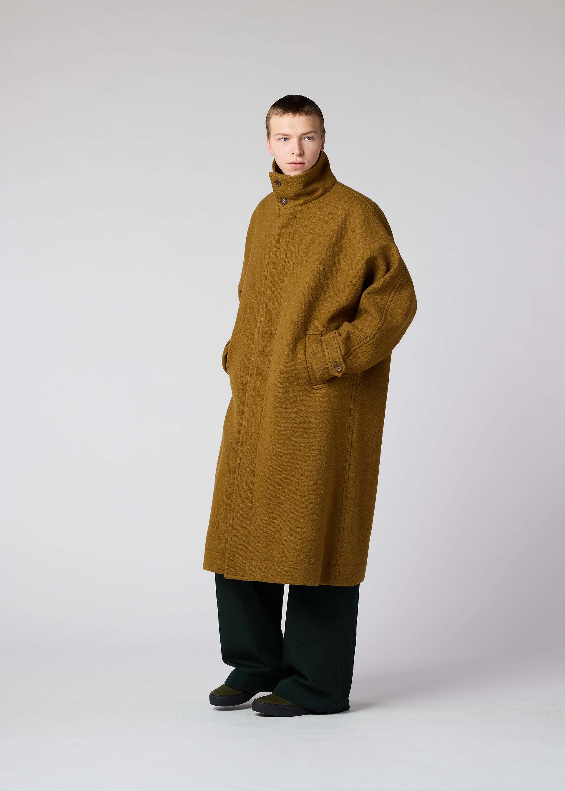 A model wears the IM Men FULLER WOOL coat.