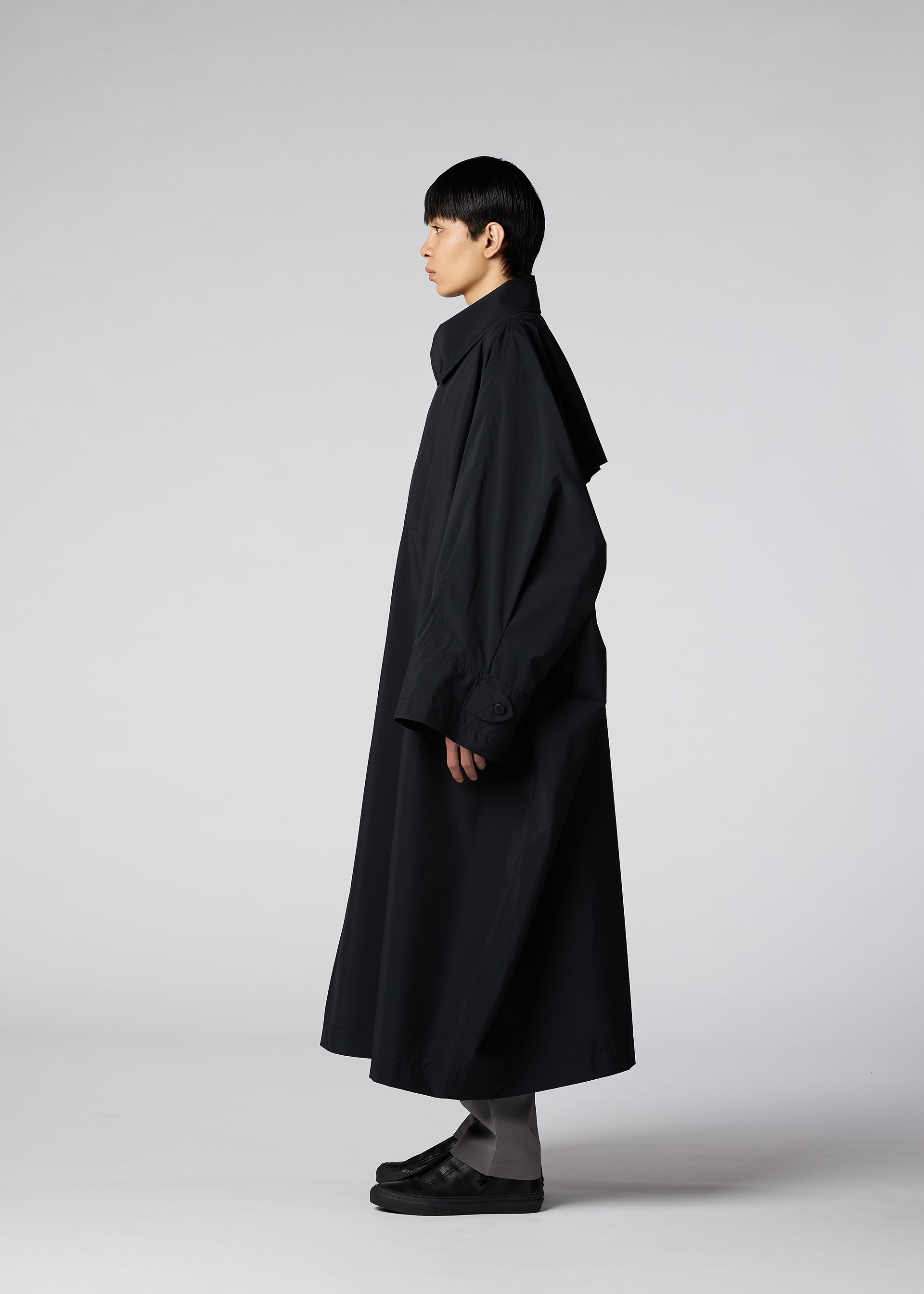 A model wears the IM Men WIND COAT LIGHT coat.