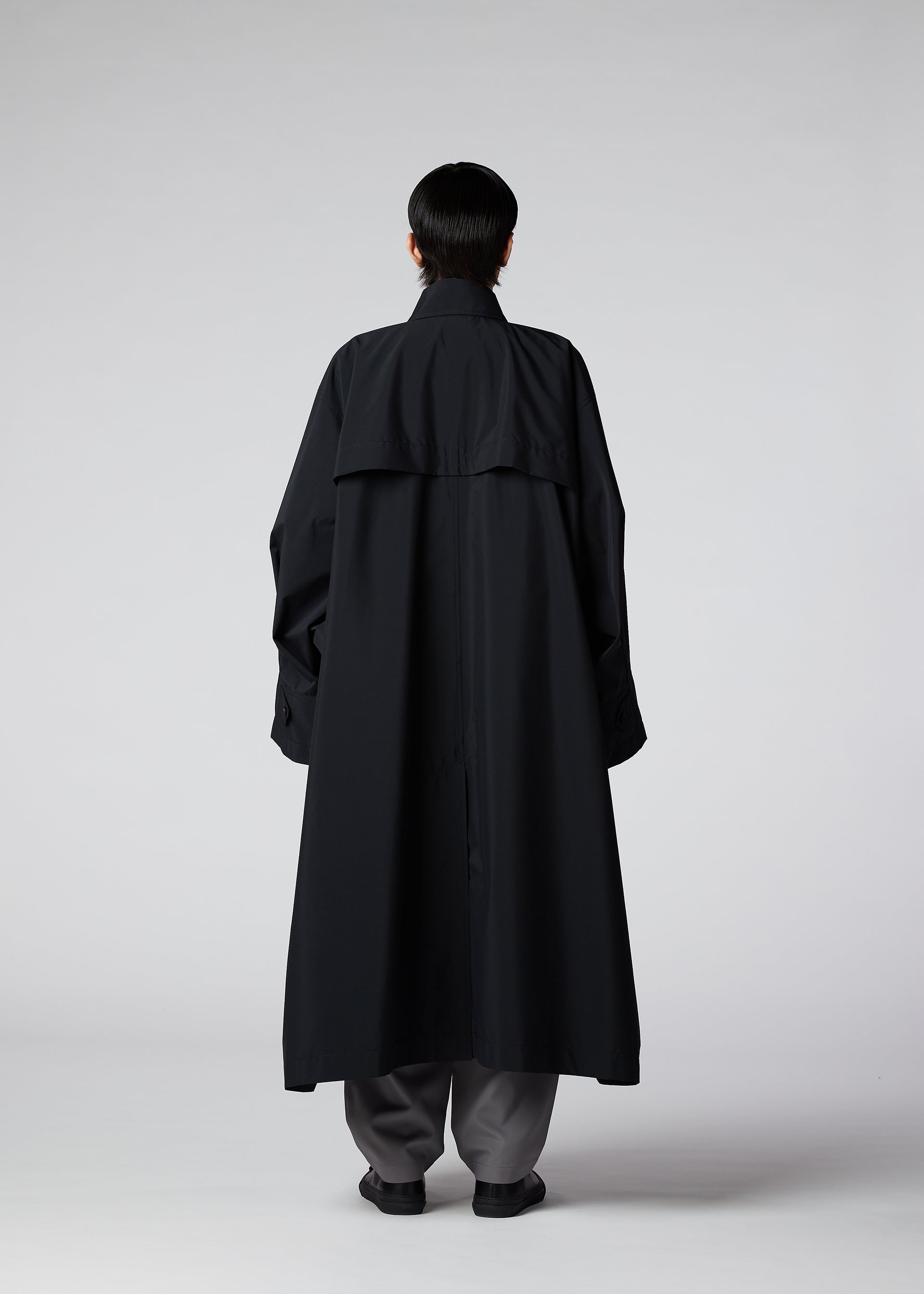 A model wears the IM Men WIND COAT LIGHT coat.