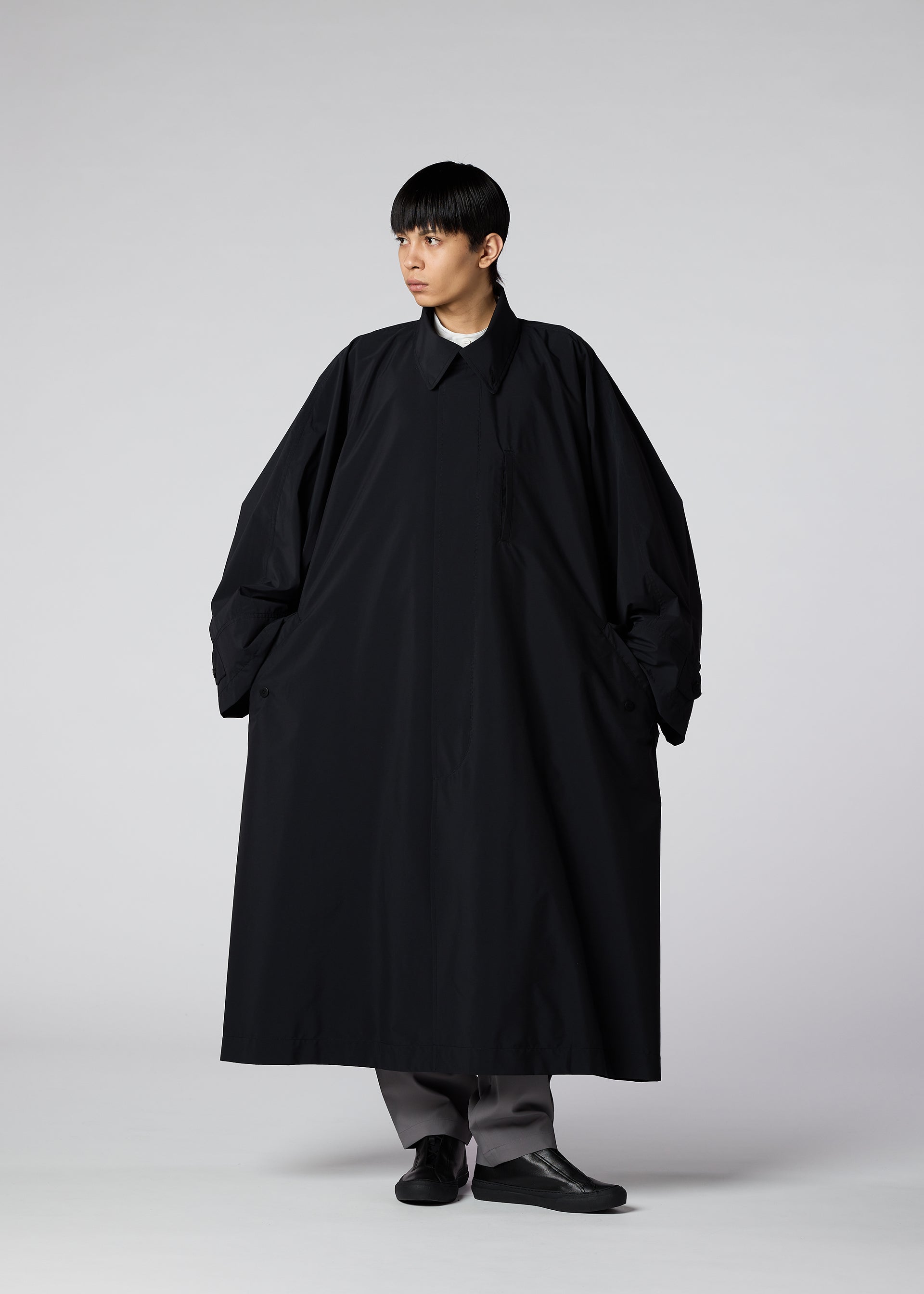 A model wears the IM Men WIND COAT LIGHT coat.