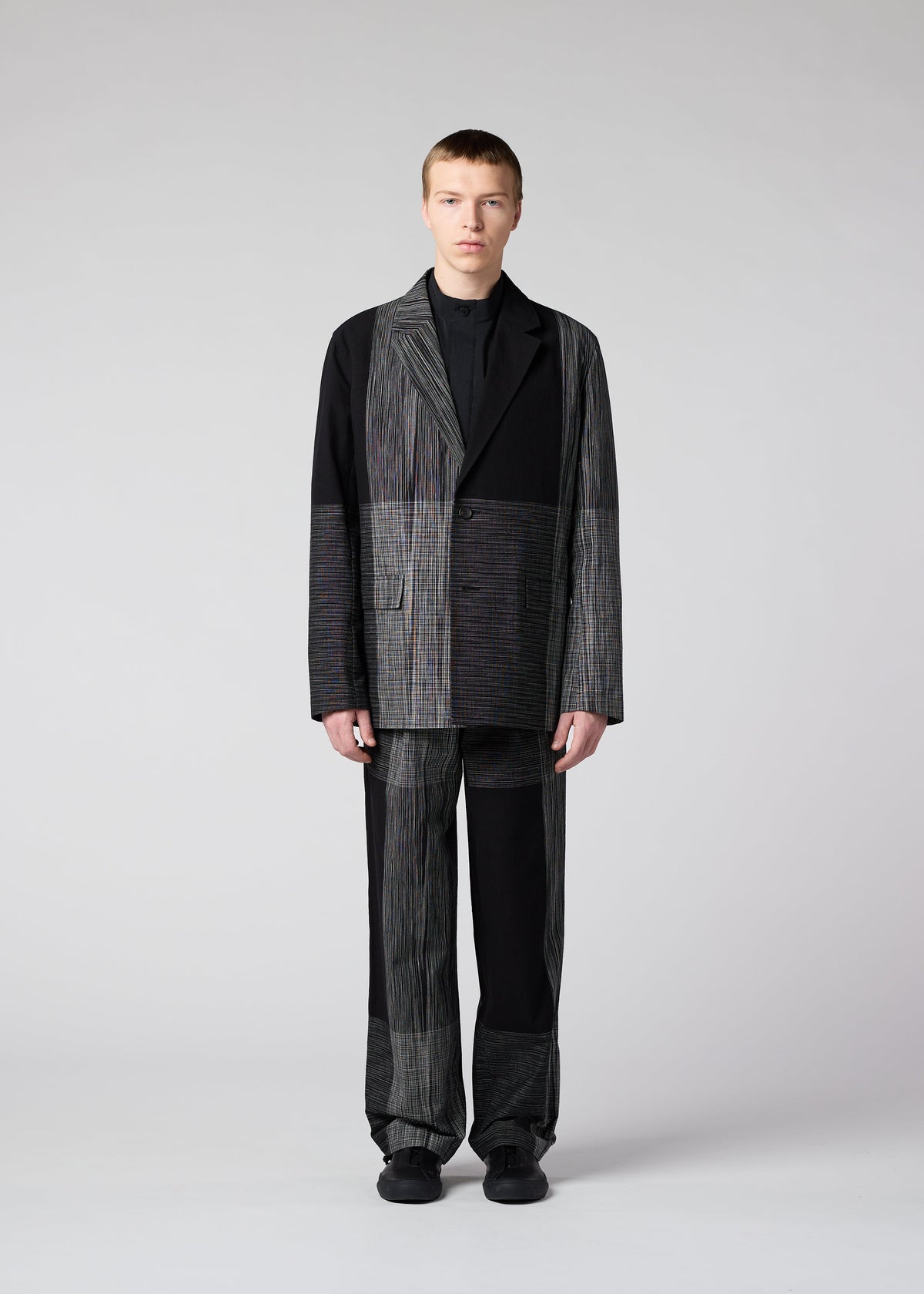 A model wears the IM MEN KASURI jacket.