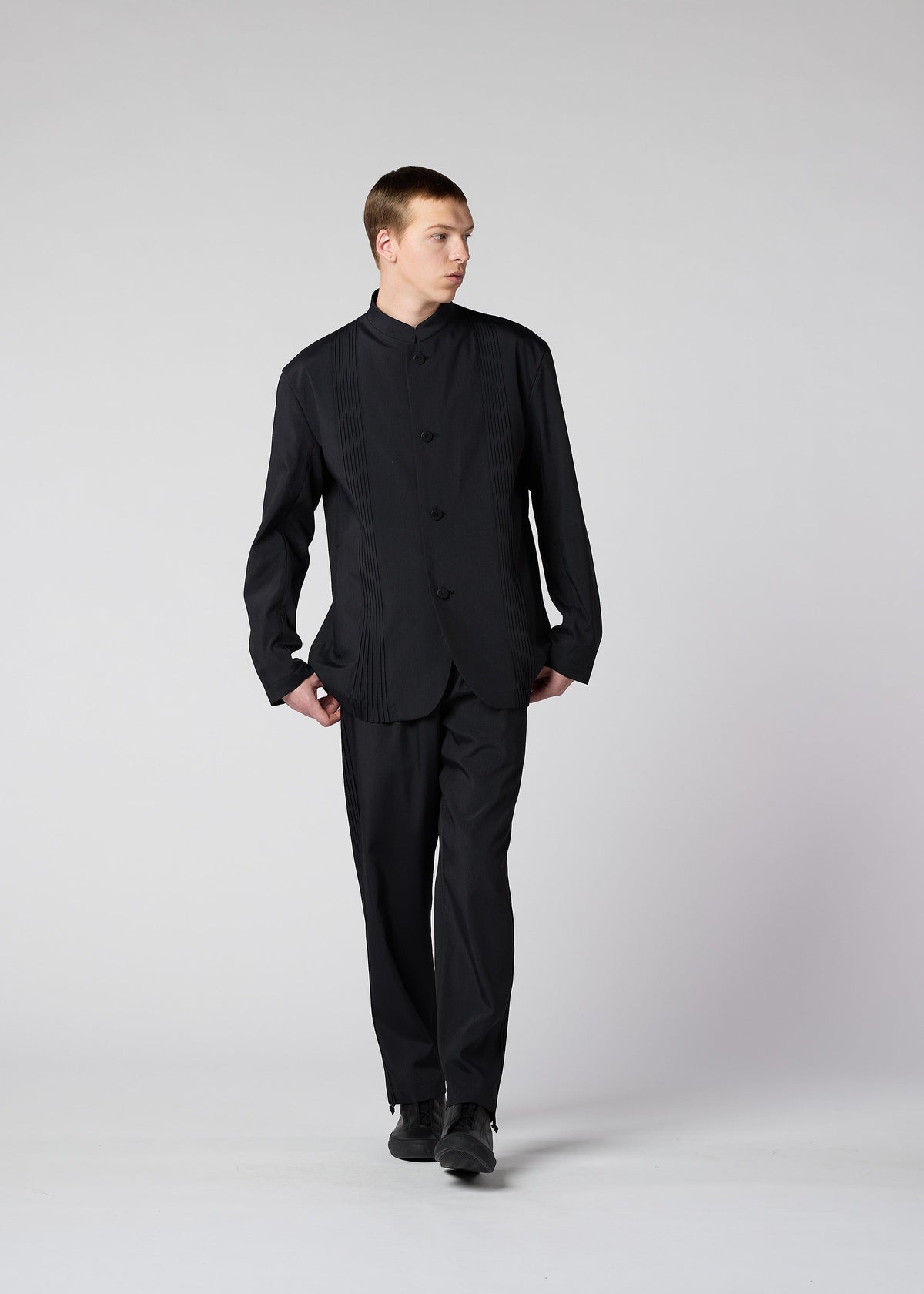 A model wears the IM Men AIR PLEATS jacket.