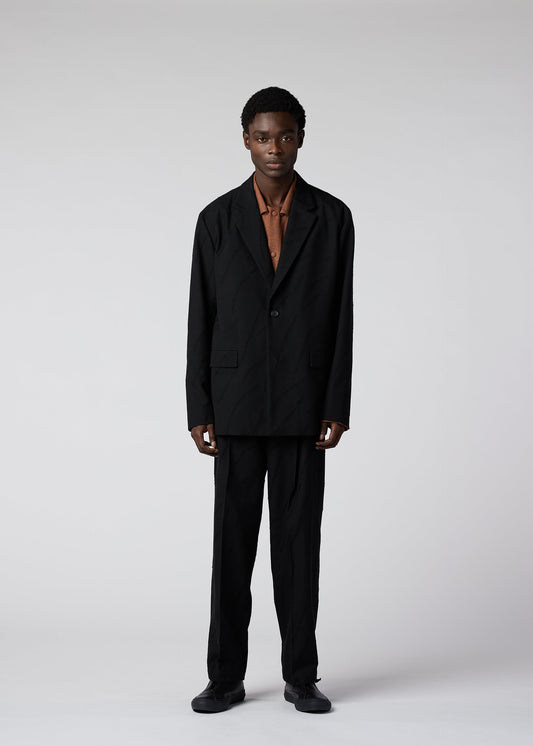 A model wears the IM MEN FLY WOOL jacket.