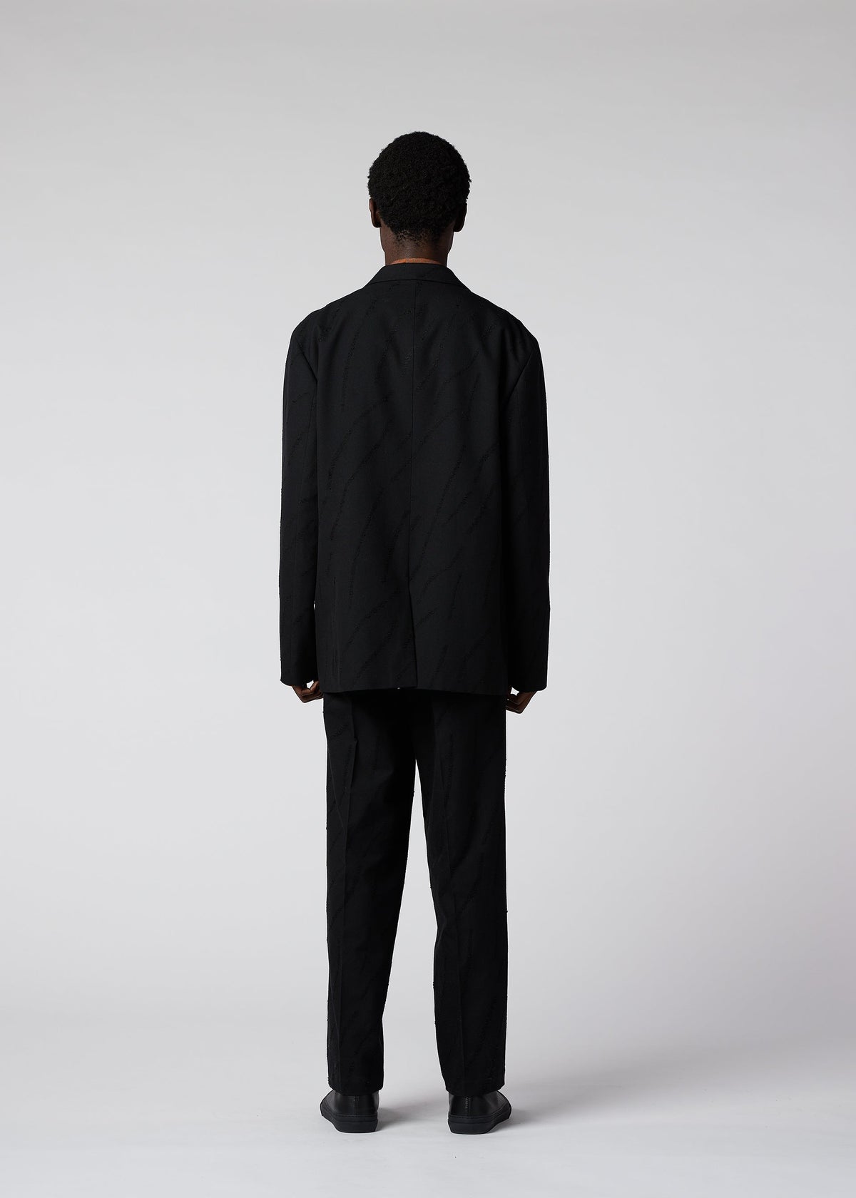 A model wears the IM MEN FLY WOOL jacket.