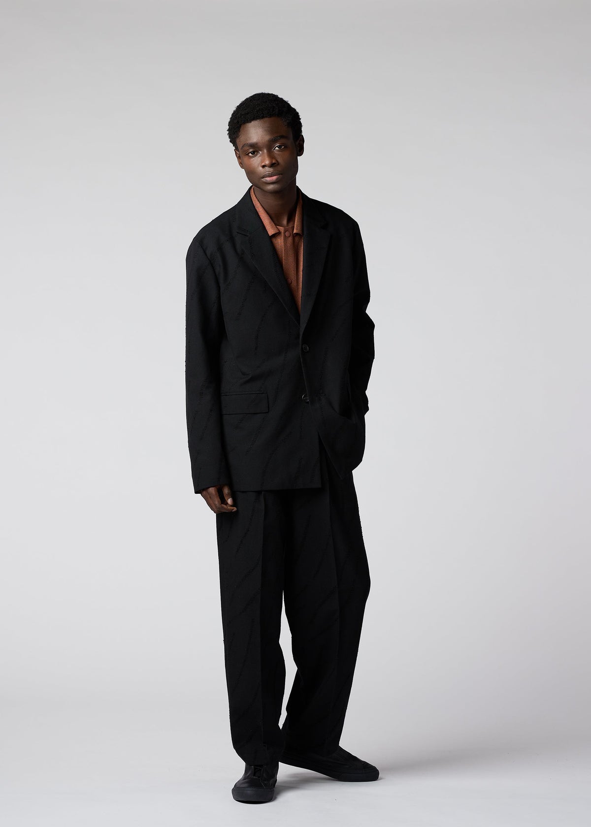 A model wears the IM MEN FLY WOOL jacket.