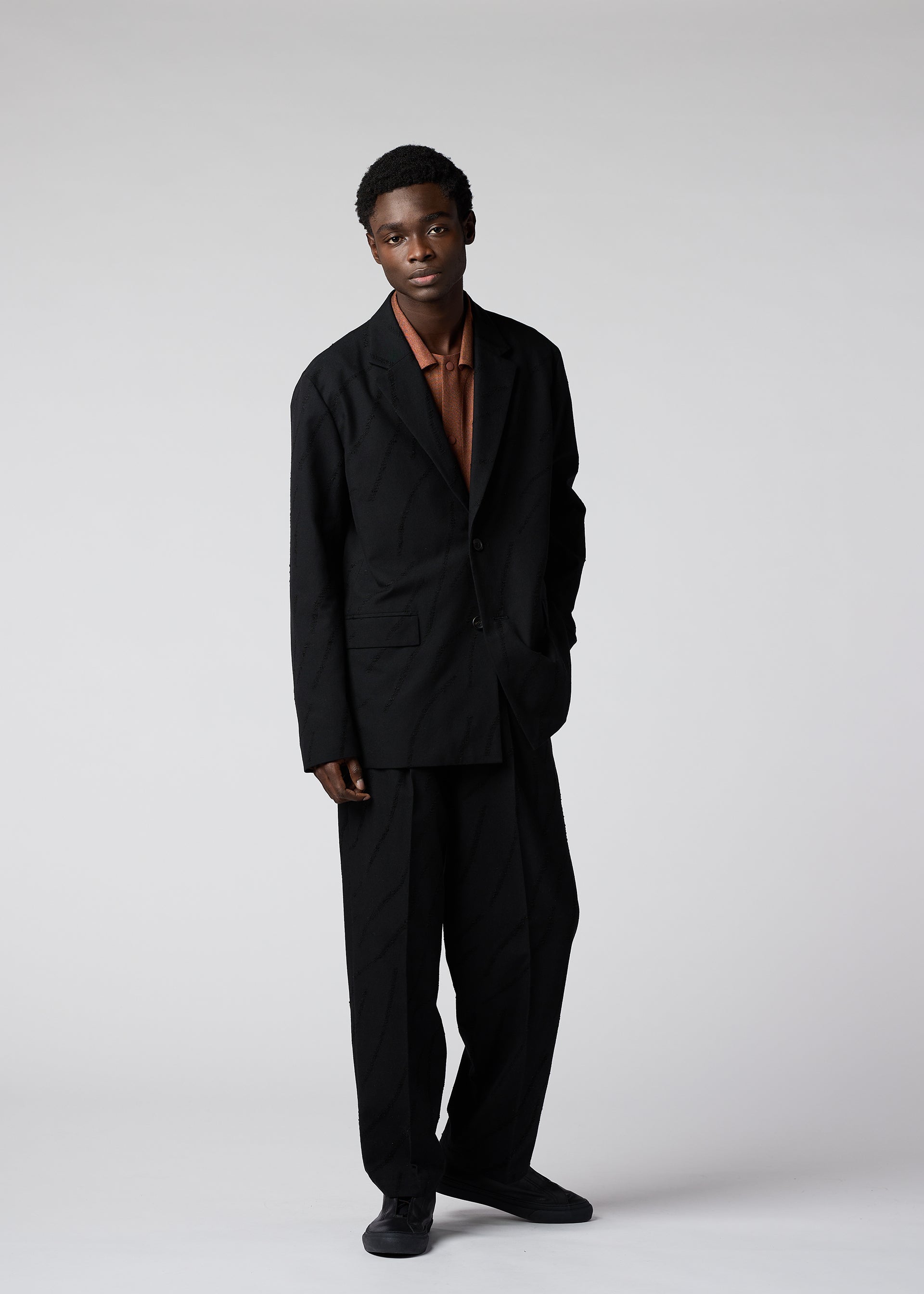 A model wears the IM MEN FLY WOOL jacket.