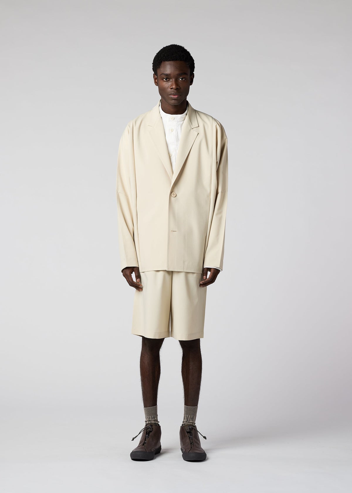 A model wears the IM Men FLAT jacket.