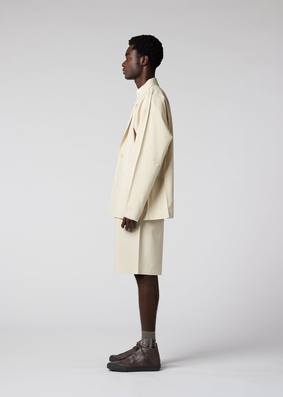 A model wears the IM Men FLAT jacket.