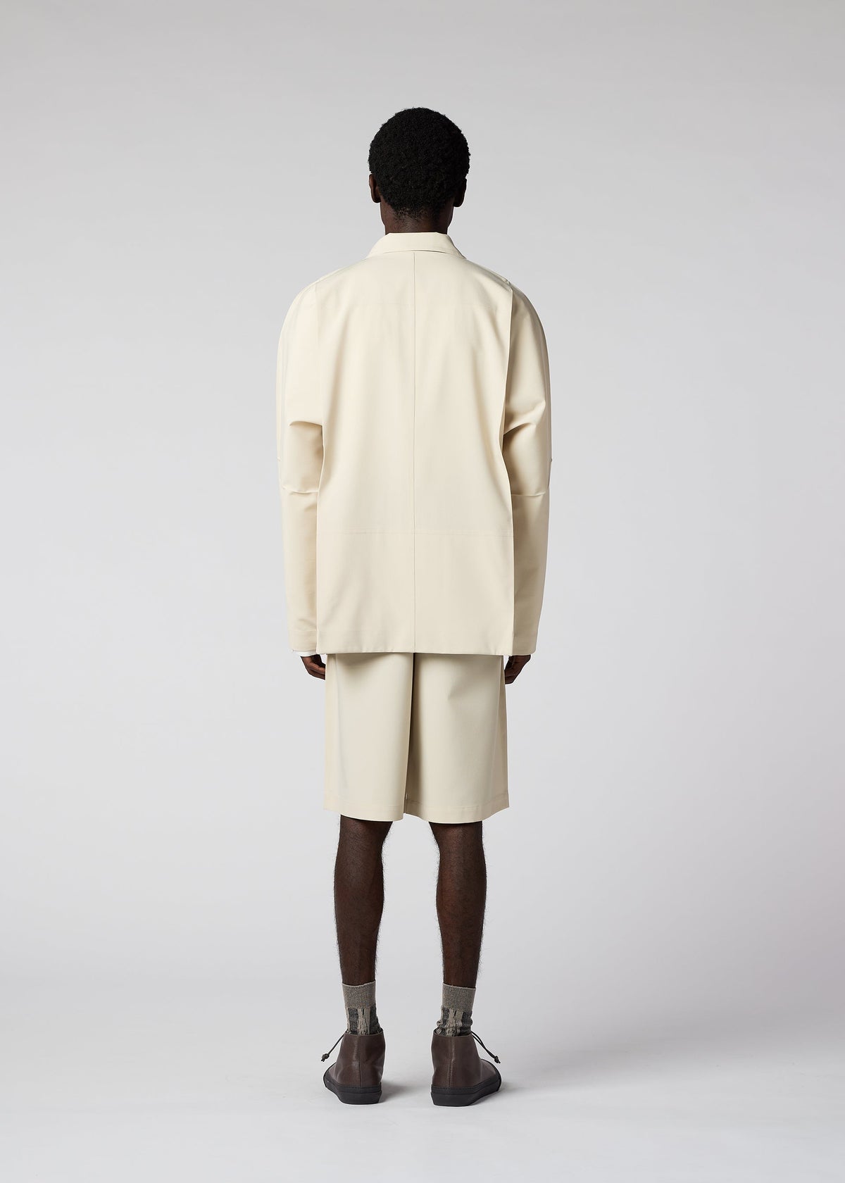 A model wears the IM Men FLAT jacket.