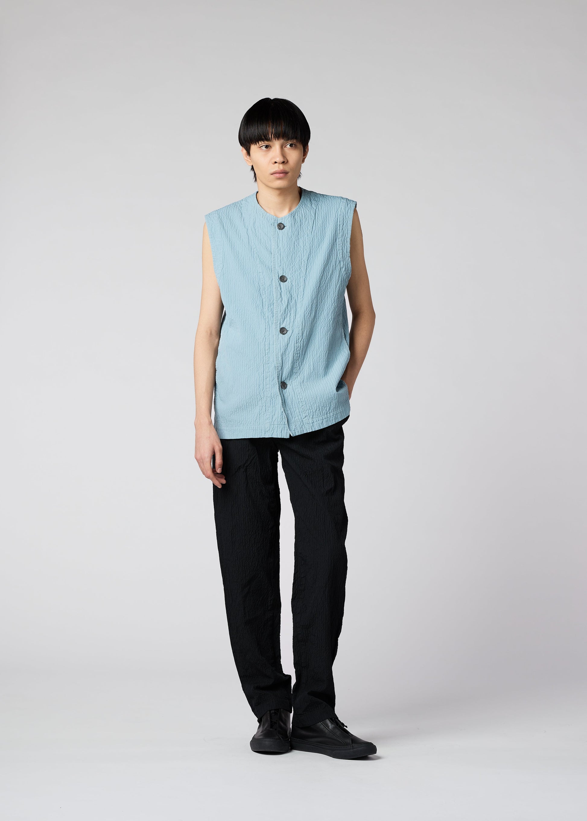 A model wears the IM MEN SHRINK DYE vest.