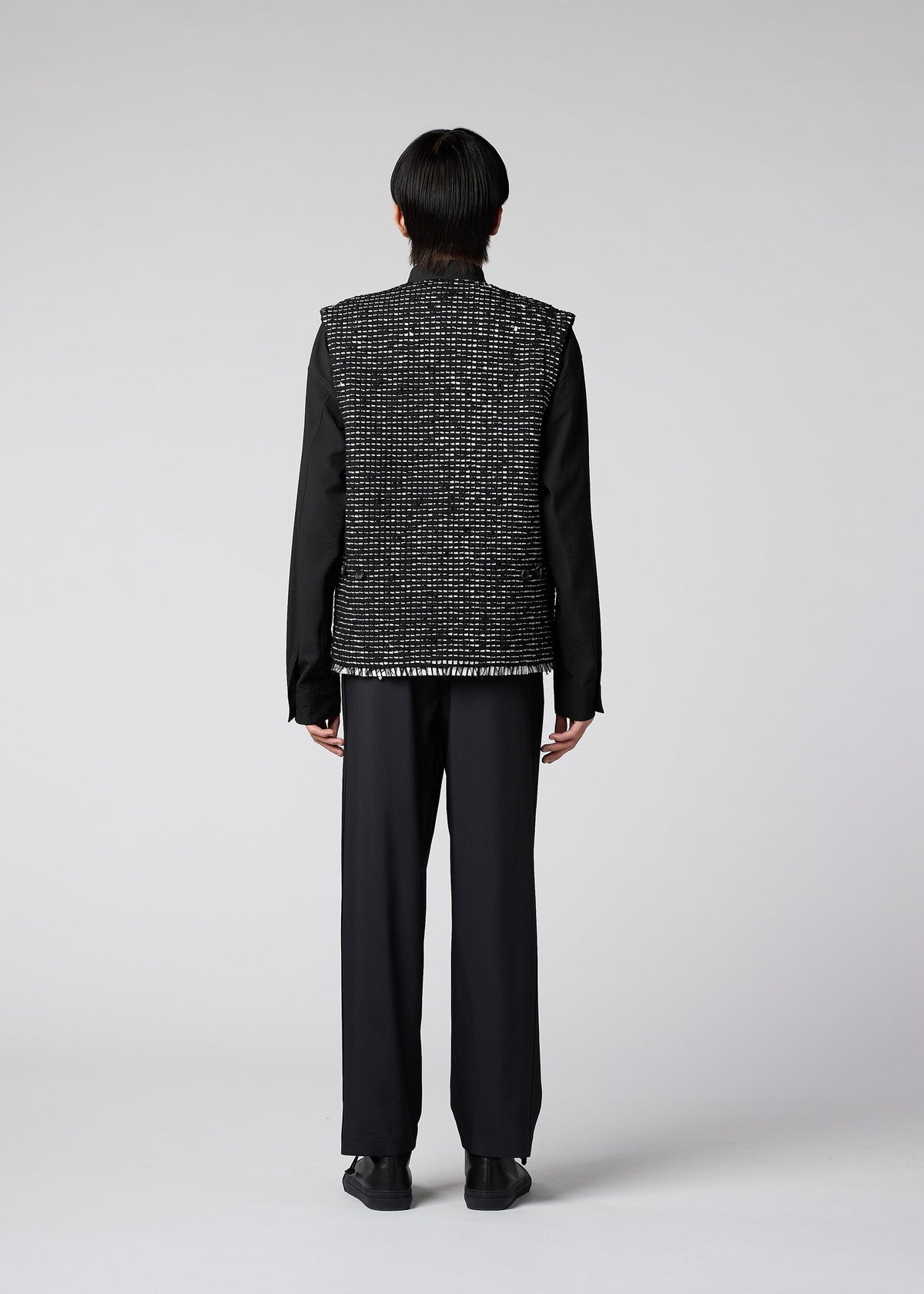 A model wears the IM Men SAKIORI vest.