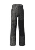 A detail shot of the IM MEN KASURI trousers.