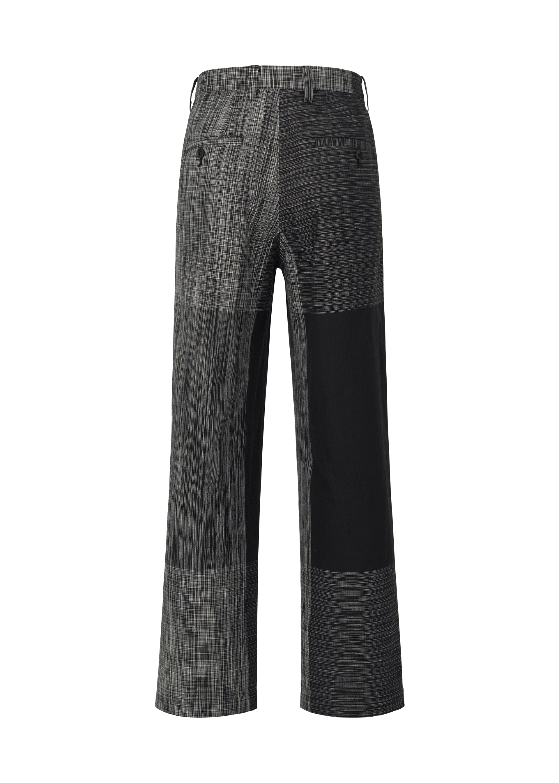 A detail shot of the IM MEN KASURI trousers.