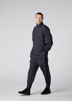 A model wears the IM MEN WAFT trousers.
