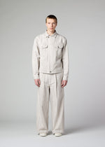 A model wears the IM Men COTTON JACQUARD trousers.