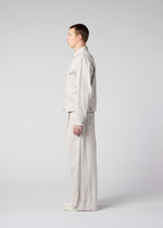 A model wears the IM Men COTTON JACQUARD trousers.