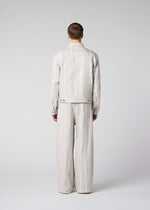 A model wears the IM Men COTTON JACQUARD trousers.
