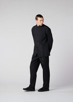 A model wears the IM Men AIR PLEATS trousers.