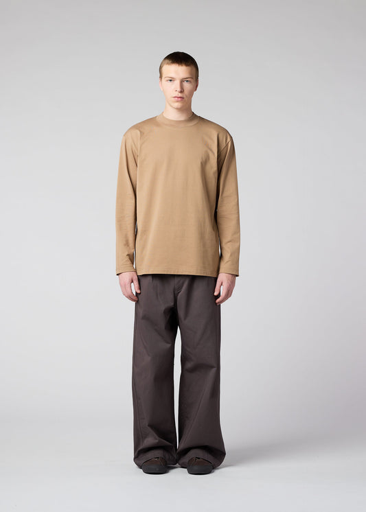 A model wears the IM Men TOUGH COTTON trousers.