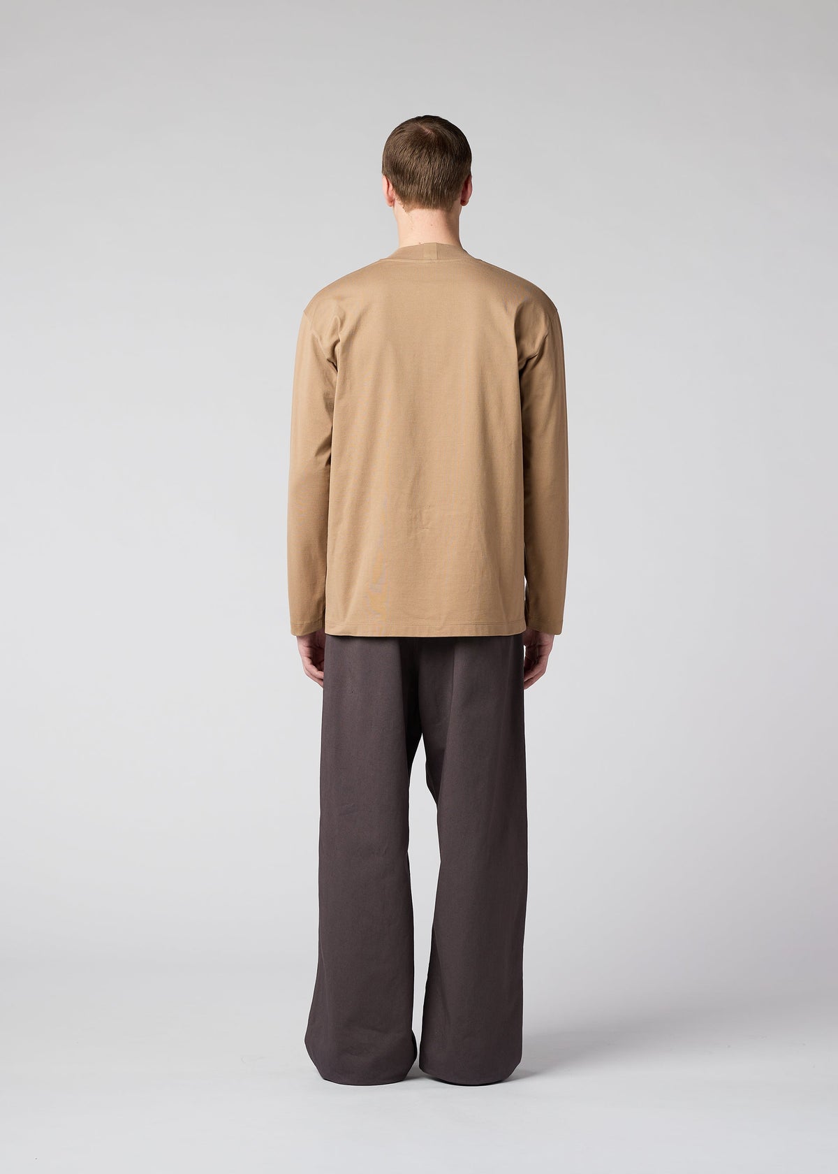 A model wears the IM Men TOUGH COTTON trousers.