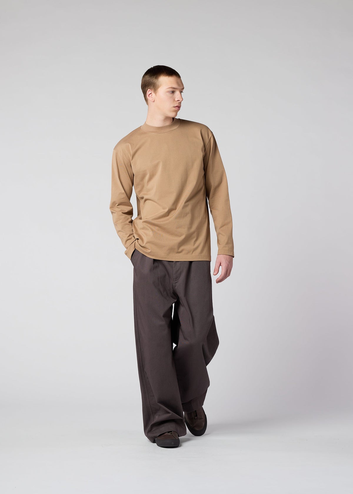 A model wears the IM Men TOUGH COTTON trousers.