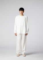 A model wears the IM Men LIGHT COTTON trousers.