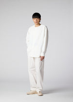 A model wears the IM Men LIGHT COTTON trousers.