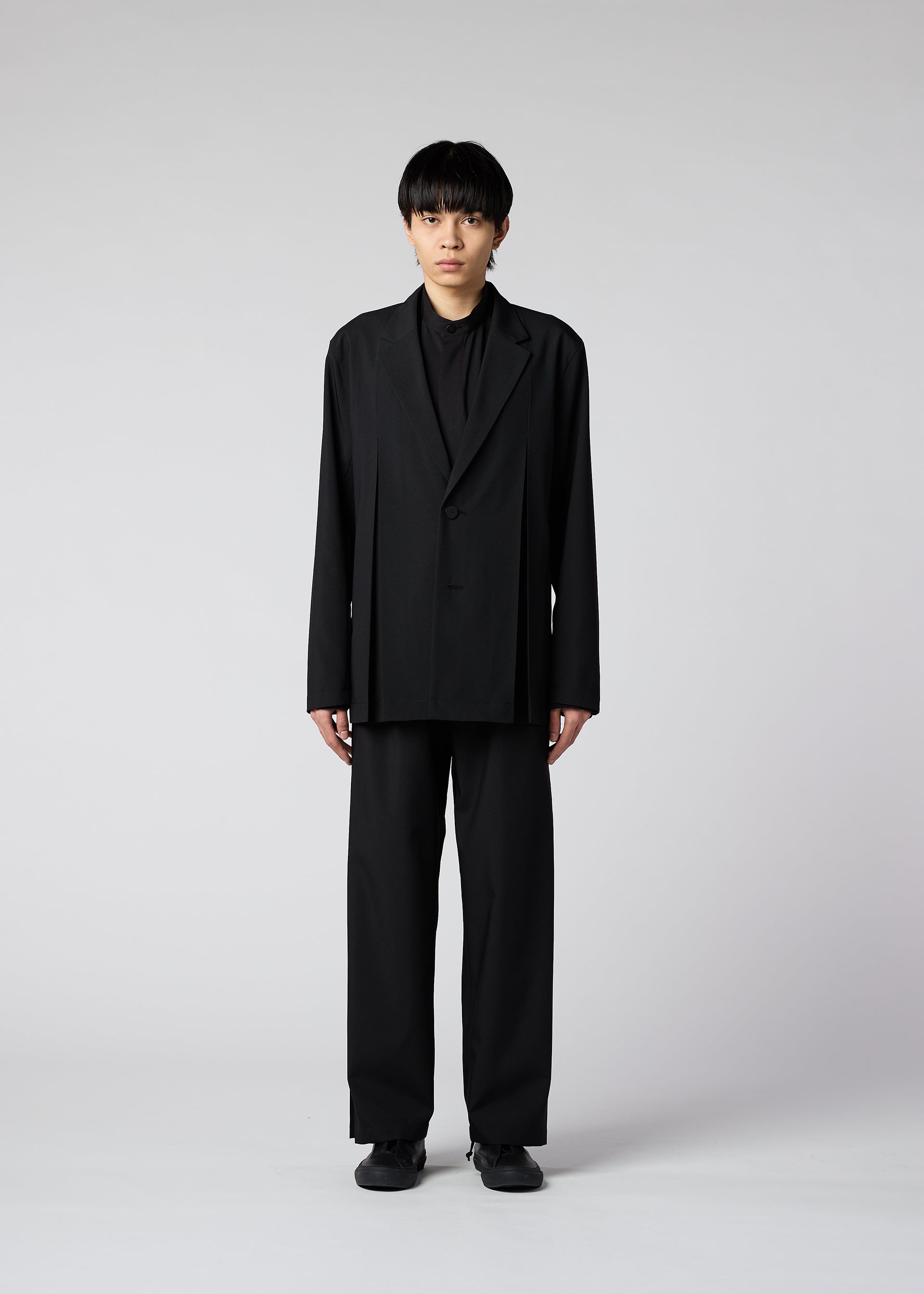 A model wears the IM MEN WINGS trousers.