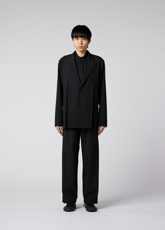 A model wears the IM Men WINGS trousers.