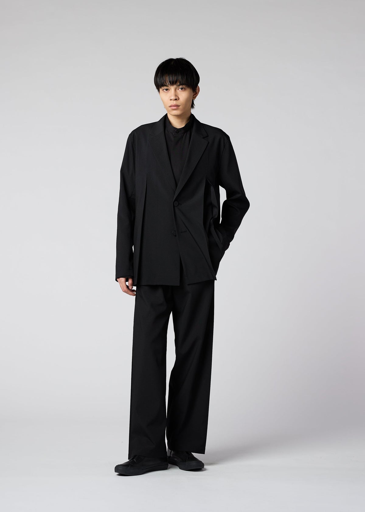 A model wears the IM MEN WINGS trousers.