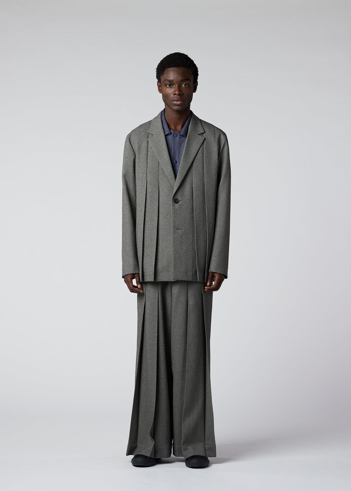 A model wears the IM Men WOOL LIKE TWEED trousers.
